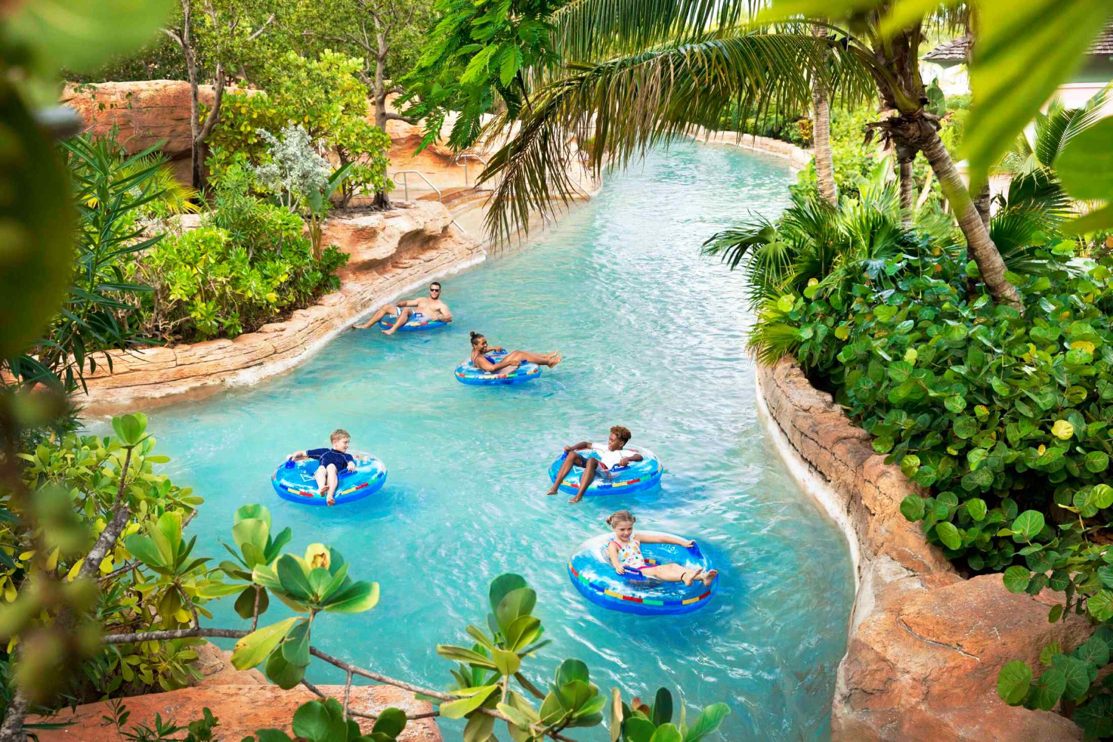 A view of parents and kids relaxing in the pool
